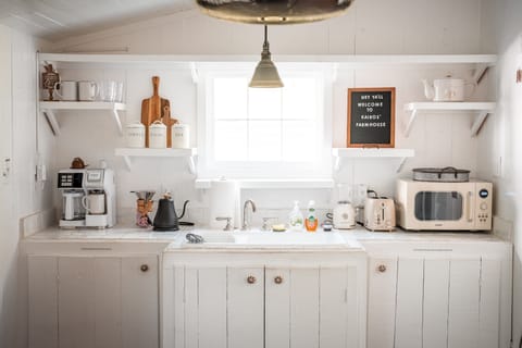 Bright Kitchenette in the Sunroom with a window to birds and squirrels scurrying