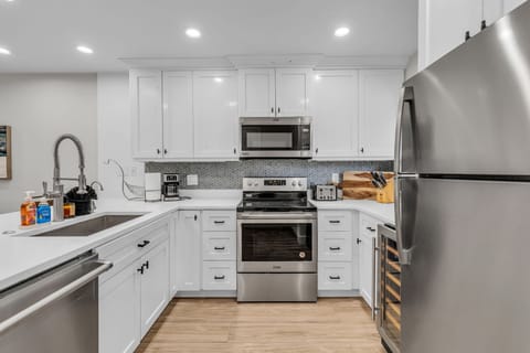 Kitchen: Well-equipped kitchen, updated appliances, drip coffee maker and French Press, kitchen bar w/4 bar stools 
