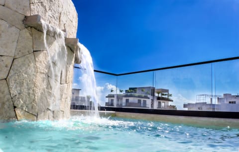 Enjoy your days pool side at Condo TAAKs semi-private rooftop pool. 
