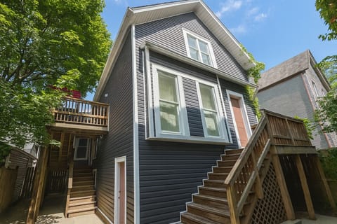 Side stairwell to Entrance of Unit (see red umbrella on deck)