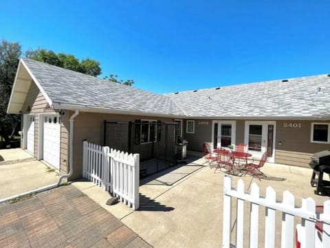 Front patio with kennel, and grill