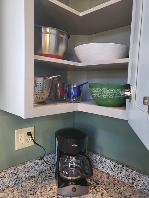 Mixing  and salad bowls, colander.
We have a coffee pot as well as a Kuerig 