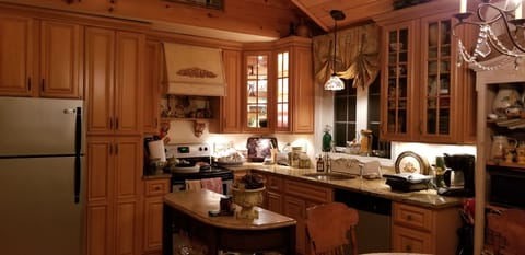 Full kitchen with stove, fridge, microwave, dishwasher, coffee maker, and more
