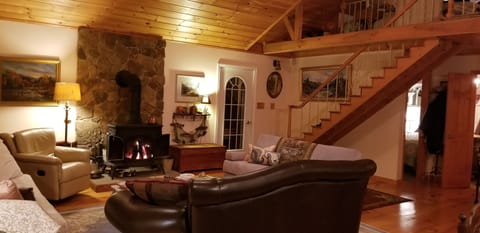 Great room with woodstove and cathedral ceilings