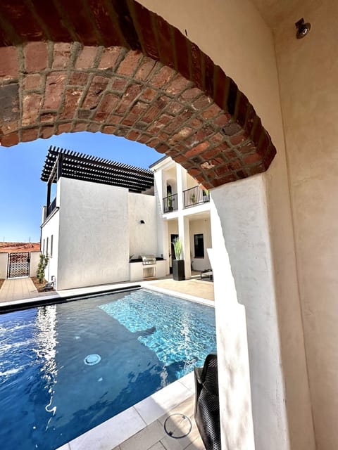 Arches and views of the pool and courtyard