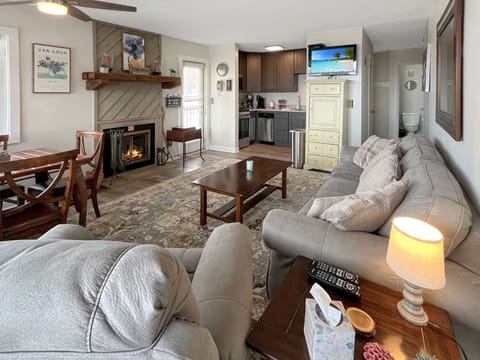 Enjoy the living room with cozy fireplace, 2 walk out decks.  Family time.