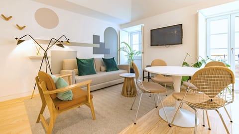 Spacious and modern living area with green and grey accents and natural light in the heart of Lisbon. Perfect for relaxation and a memorable stay #andoliving #modern #relax #memorablestay #lisbon #pt #portugal