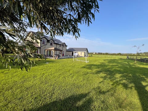 Rear lawn with soccer goal and badminton nets