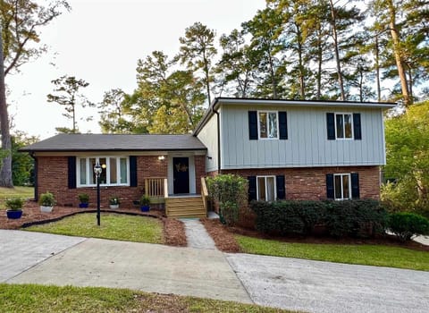 Front of the home - security cameras on the outside only. Circular drive.