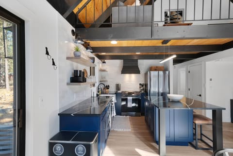 Stocked gourmet kitchen with brand-new appliances.