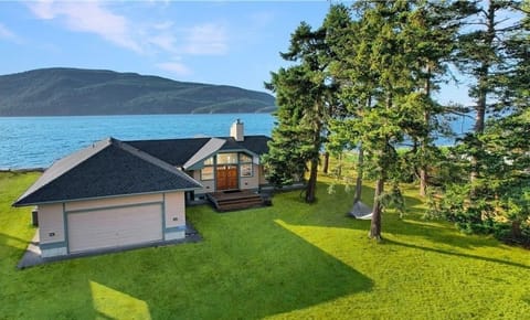 Our home features 90 feet of low bank beach in the rain shadow of the Olympics.