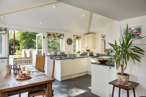 A well-equipped kitchen leading out onto the Mediterranean style patio