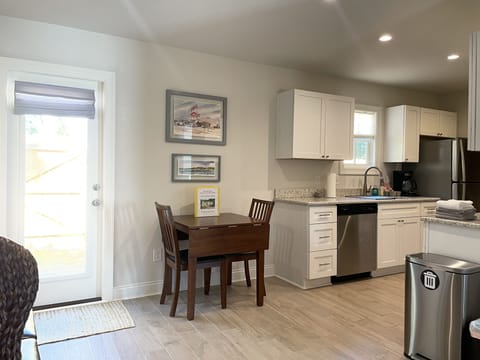 View of the dining area and kitchen.