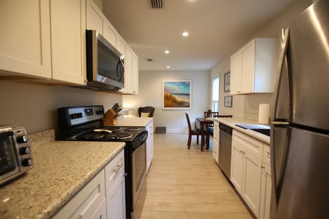 The full kitchen is equipped with all the usual appliances, and a dishwasher!