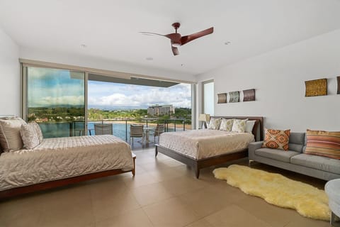 Bedroom suite with king and queen bed, sectional and kitchenette