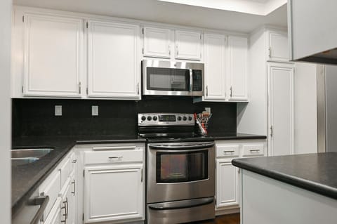 kitchen with microwave, electric range, air fryer, instant pot, and more
 
