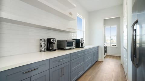 Oversized butler's pantry off the kitchen with second fridge, appliances, and walk-in pantry will accomodate all of your kitchen storage needs