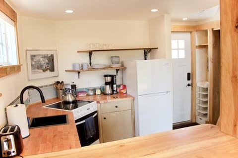 Full kitchen including refrigerator, electric range, microwave and essentials