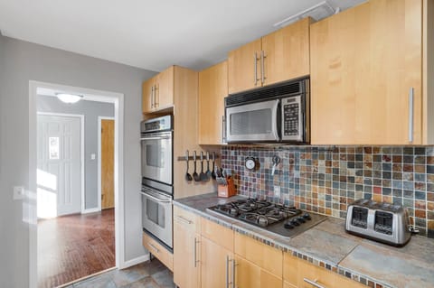 Kitchen with double ovens and 4 burners