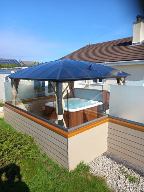 Hot Tub undercover surrounded with balcony glass