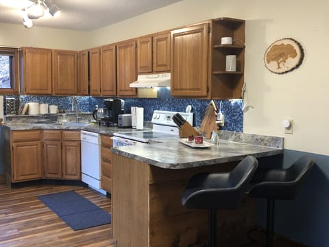 Bright and open kitchen plan with breakfast bar, all the conveniences