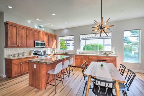 Open concept kitchen with plenty of seating at the breakfast bar & dining table.