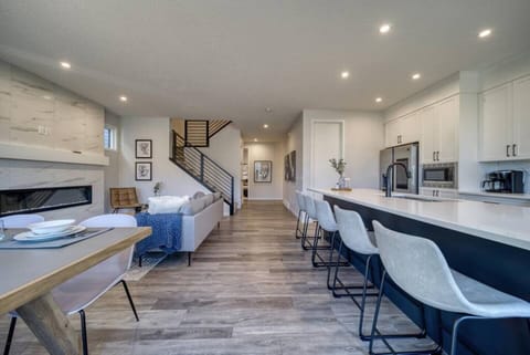 Large and welcoming living and dining area with enough space for large groups 

https://youriguide.com/321_harvest_hills_way_ne_calgary_ab