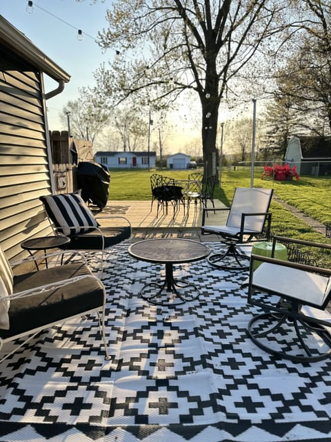 HUGE, fenced in yard with patio, firepit, lights & grill. Let the kids run free!