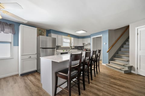 KITCHEN: Eat-in with cookware, utensils, gadgets, dinnerware, and seating for 10