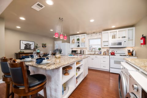 Kitchen boasts coffee & cocktail bar, toaster oven, gas range, ice machine.