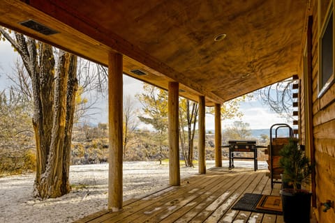 Covered deck with grill. 