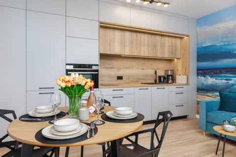 A dining area with a fully set table and stylish surroundings.
