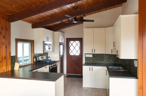 A modern mountain kitchen, recently redesigned with locally sourced, Green Mountain-inspired artisan tile.