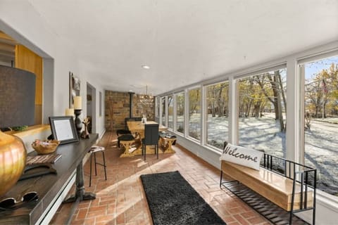 Enter into the dining room with walls of windows to enjoy the scenery & sunsets.