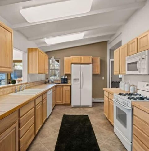 Kitchen provides lots of counterspace and appliances to entertain. 