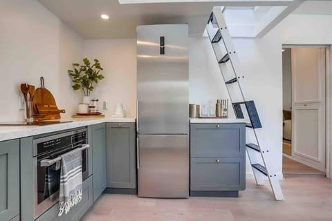 The ladder leads to the Loft Net area above and the doorway to the right has a hidden pocket door for extra bedroom privacy. 