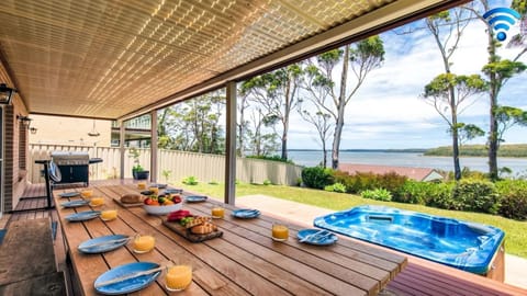 Alfresco dining area with gas BBQ and amazing views of lake 