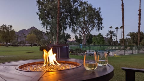 Enjoy a drink with a view by the outdoor firepit