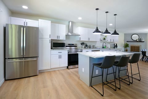 Spacious and modern kitchen equipped with brand new appliances.