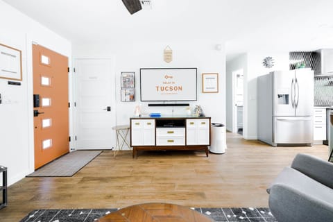 Mid-century inspired entertainment area with local Tucson artwork.