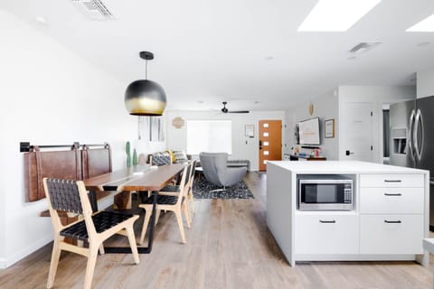 Flow from cooking to hanging out happens naturally in this open layout.