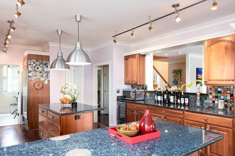 1st Floor Chef's Kitchen with Island and Seating Area