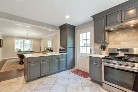 Kitchen is fully stocked with a stove, microwave, toaster, coffee makers & more.