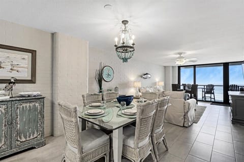 Coastal Dining Area with Gulf-View Living Space Beyond