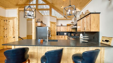 The kitchen bar seats three.