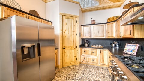 The kitchen has plenty of cupboard/pantry space.