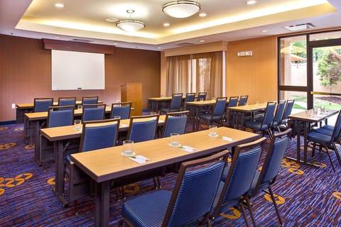 Host productive sessions in a spacious classroom-style meeting room.