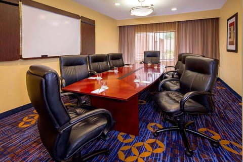 Collaborate comfortably around the executive table with natural light.