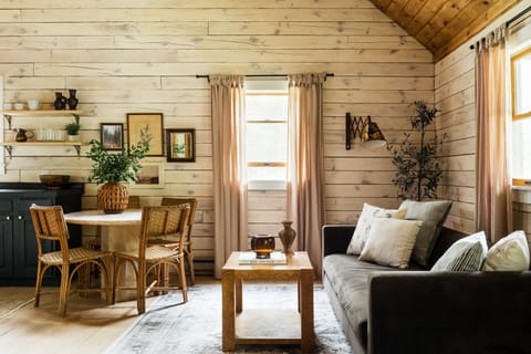As you enter the cabin, you are welcomed by the living area~