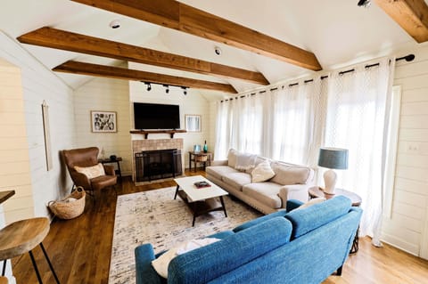 Large family room with 55" Roku TV.